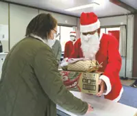 Santas in Japan hand out Christmas gifts to people affected by massive wildfire in Iwate Prefecture earlier this year