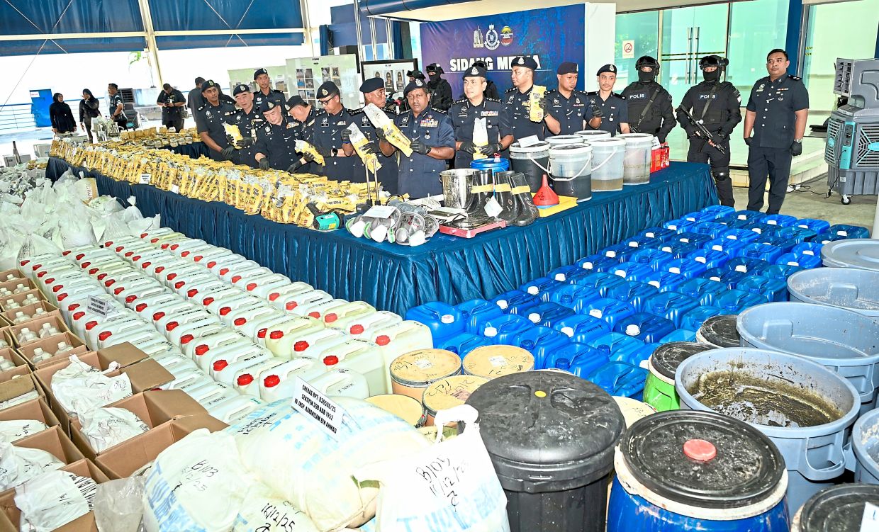 Big haul: The 18 tonnes of drugs laid out during the press conference at the Kuala Lumpur police headquarters.