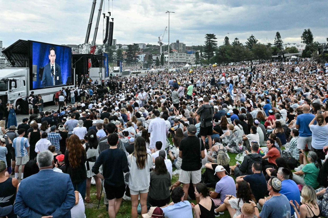Mourners attend the memorial held for the victims of a shooting at Bondi Beach in Sydney on Dec 21, 2025.- AFP