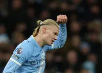 Soccer-Haaland propels Man City to top with double against West Ham