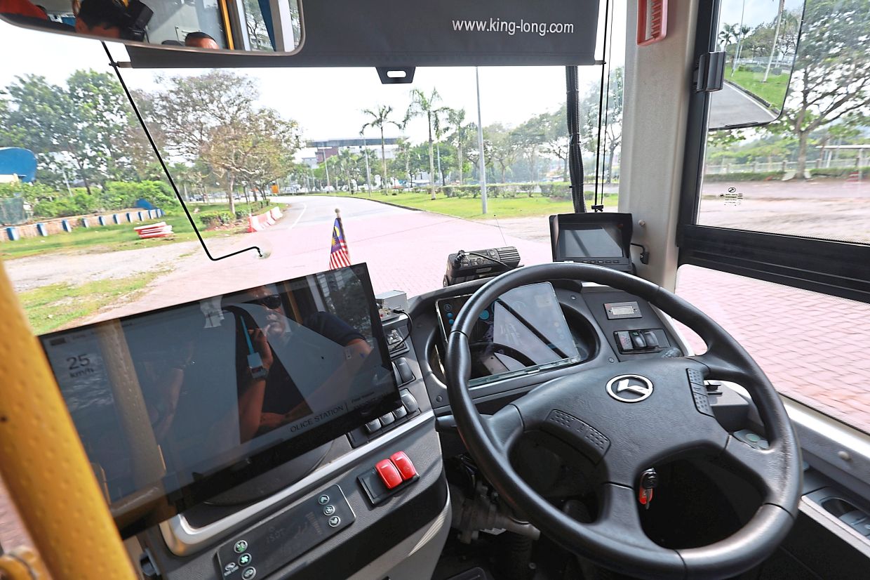 The steering wheel turning autonomously during the demo in Cyberjaya. — KAMARUL ARIFFIN/TheStar