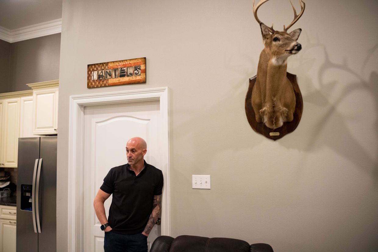 Joseph 'Tucker' Daniels listens to lawyers at his home in Thibodaux, La., on Nov 13, 2025, after speaking about his 13-year-old daughter being bullied with AI-generated deepfake pornographic images created of her by a boy classmate at Sixth Ward Middle School in August. — AP