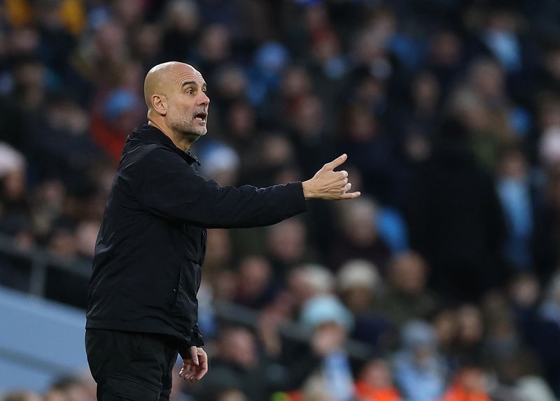 Soccer-Guardiola tells Man City players to go easy on Christmas dinner