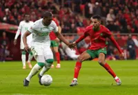 Soccer-Morocco overcome early nerves to beat Comoros in Cup of Nations opener