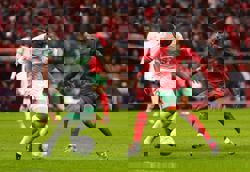 Soccer-Morocco overcome early nerves to beat Comoros in Cup of Nations opener