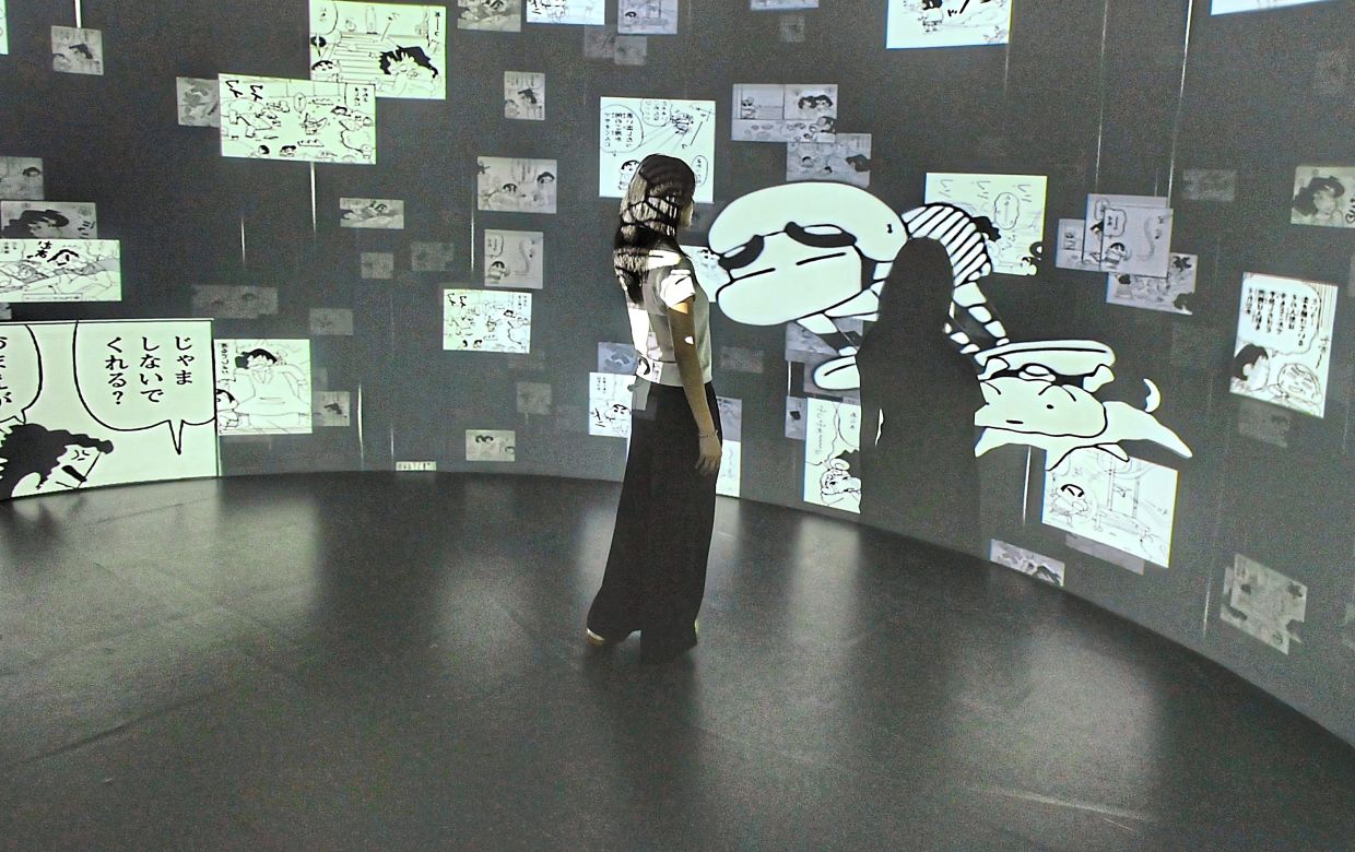 Presented as a walk-through experience, the exhibition combines recreated scenes, projections and interactive features. Photo: The Star/Raja Faisal Hishan 