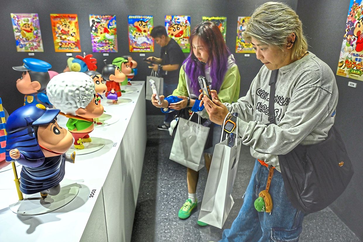 Fans can discover the evolution of characters, rare movie posters and archival exhibits from Crayon Shinchan’s history. Photo: The Star/Raja Faisal Hishan 