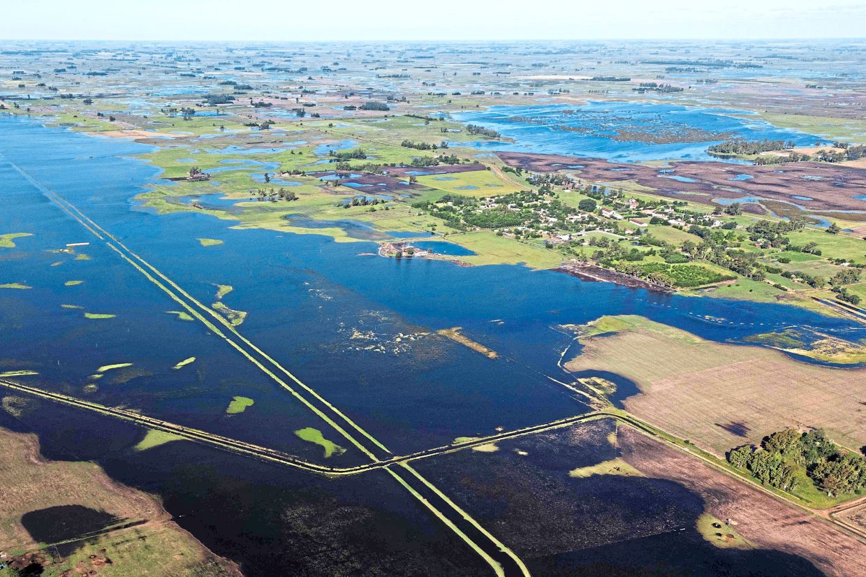 An aerial view shows a flooded field in the area.