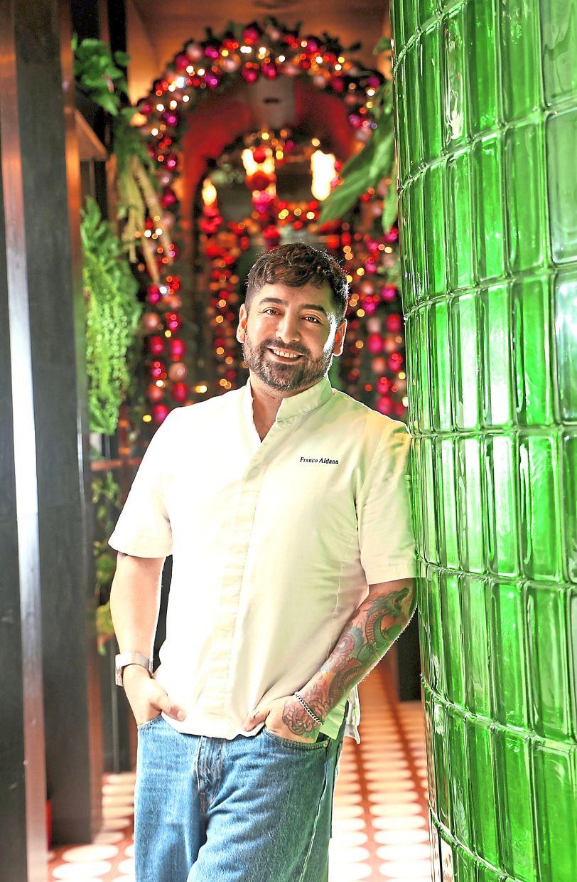 Aldana is a seasoned chef from Peru who grew up feasting on all sorts of delicious festive food during Christmas. (Right) In Aldana’s family, relatives will usually pile their plates with slices of turkey as well as other additions like Arabic rice, Russian salad and a glass of Chicha Morada. — Photos: AZMAN GHANI/The Star