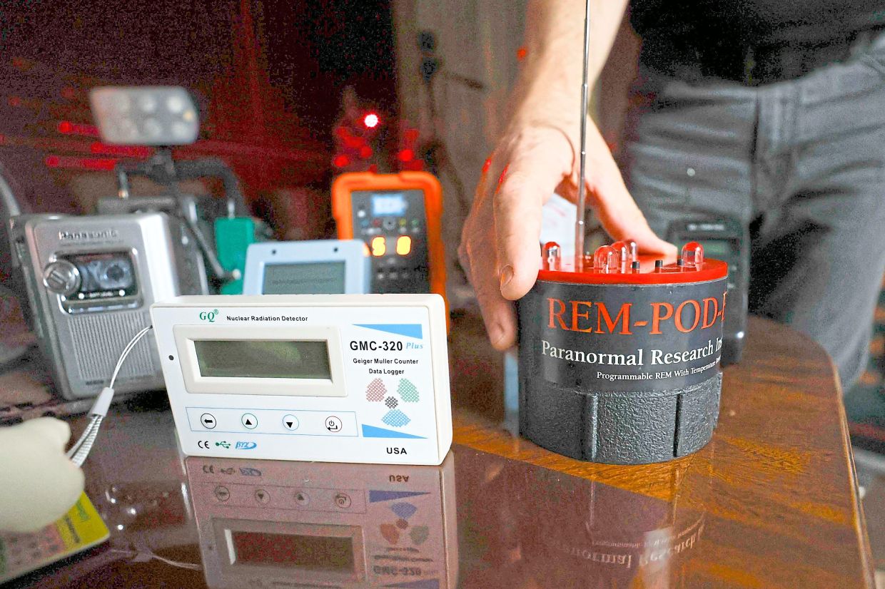 Wyatt holds a Paranormal Detector Instrument, while in the centre is a Nuclear Radiation Detector Instrument.