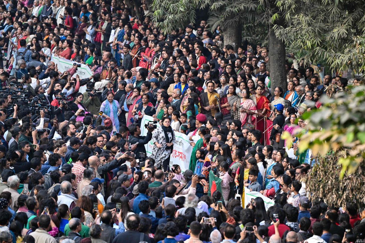 People taking part in a protest organised by cultural organisation Chhayanaut against arson and vandalism of cultural institutions in Dhaka on Dec 23, 2025. The killing of popular student leader Sharif Osman Hadi in Dhaka set off protests on Dec 18 as angry mobs torched several buildings, including two major newspapers Prothom Alo and the Daily Star deemed to favour India as well as a prominent cultural institution. - AFP