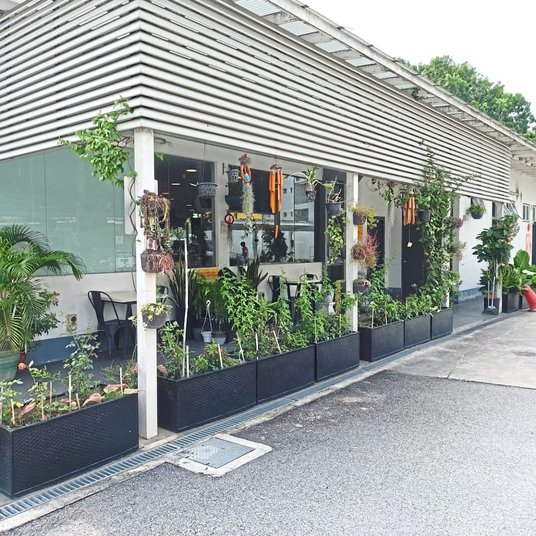 (Above and below) Greenery in the indoor and outdoor decor at the petrol station in Setia Alam.