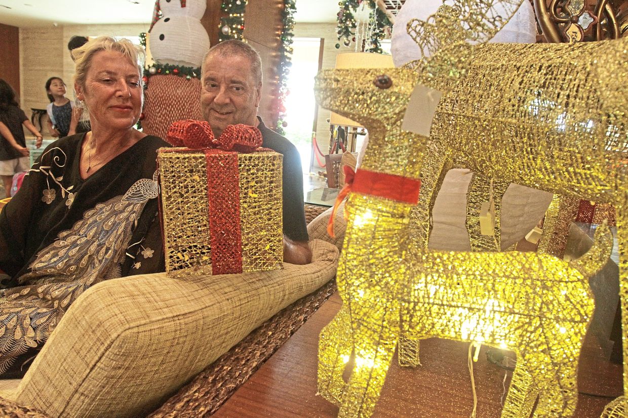 English couple Andrew and Sarah plan to celebrate Christmas in Penang for as long as they can.
