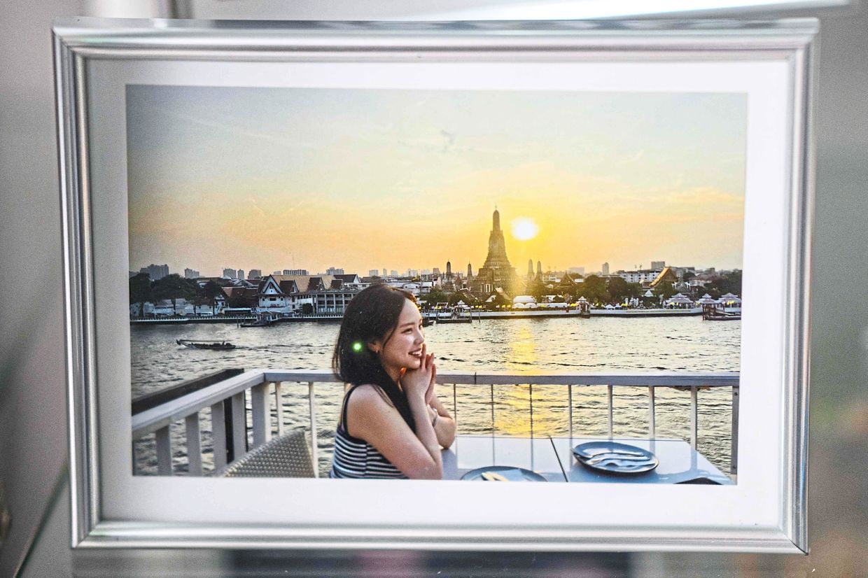 Last memory: A photo printed from a recovered phone from the wreckage of Jeju Air Flight 2216, shows one of the last pictures taken of Ye-won, a cello instructor, who had just celebrated her birthday and was due to return from a short holiday in Bangkok. — AFP