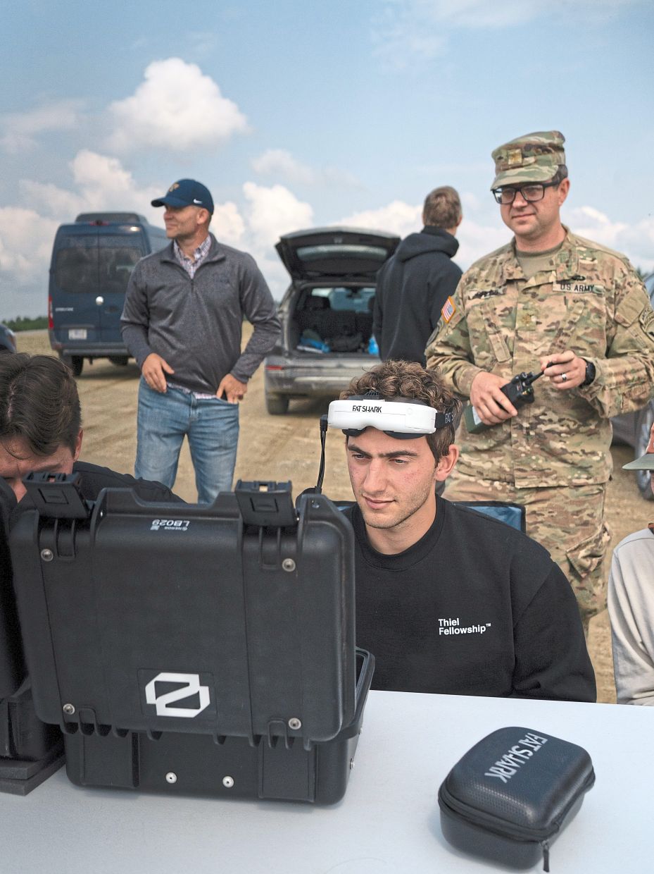 Monroe-Anderson (seated) during a drone testing event hosted by the US military at the Yukon Training Area, near Eielson Air Force Base in Alaska. — Ash Adams/The New York Times