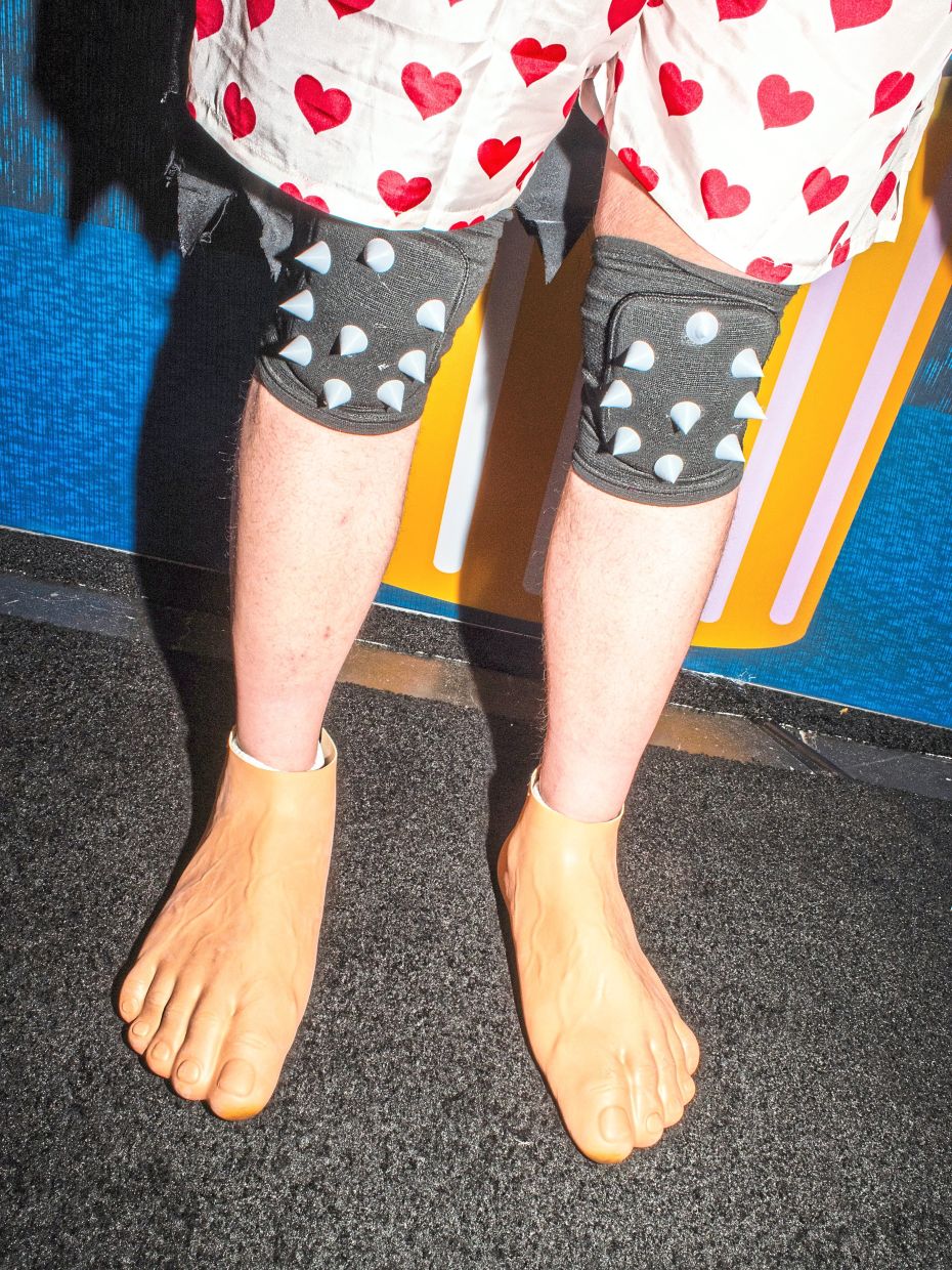 A 'Dungeon Crawler Carl' fan wears boxer shorts and shoe covers designed to look like bare feet.