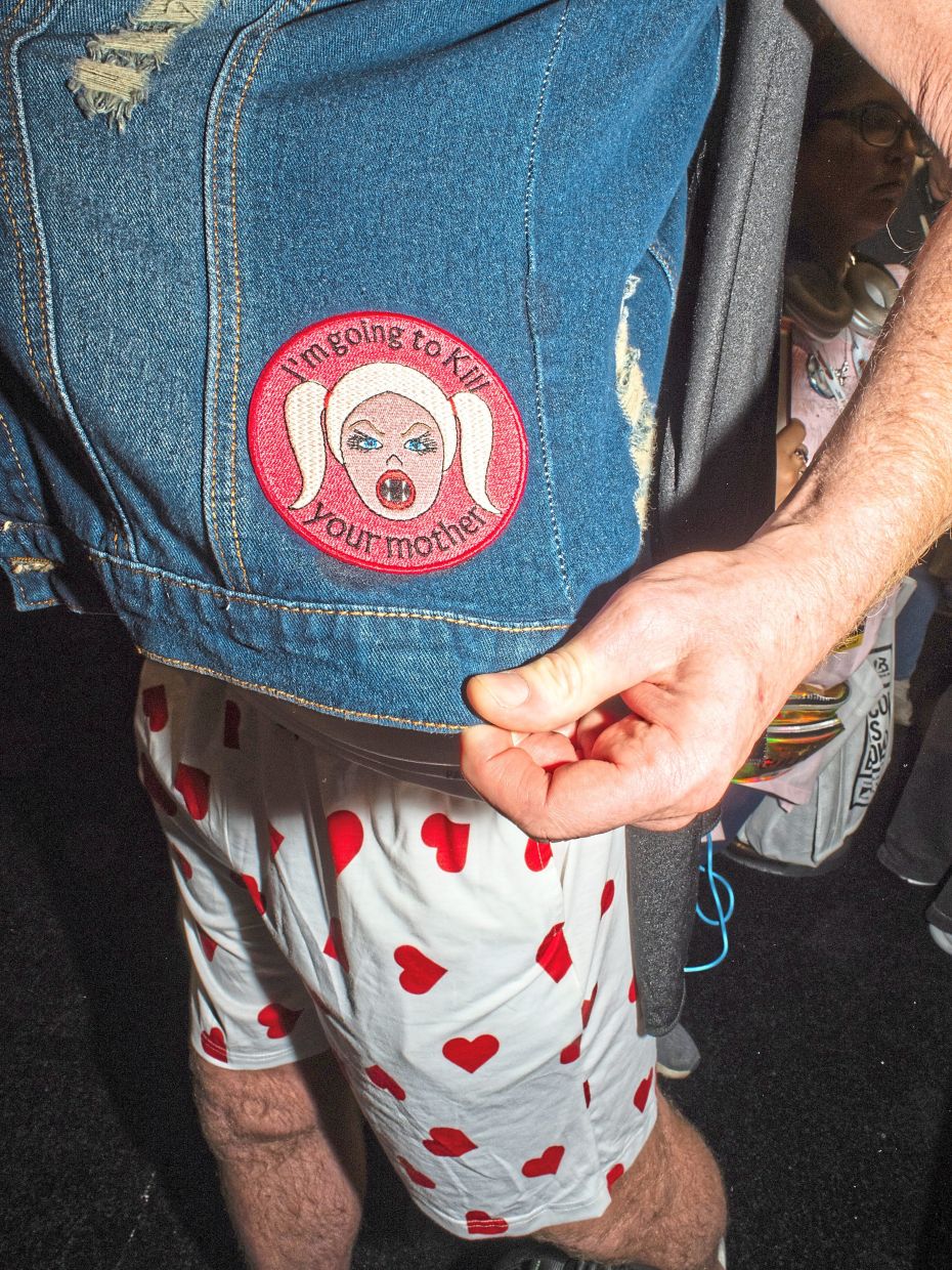 A 'Dungeon Crawler Carl' fan wears a patch on his denim jacket that references the book.