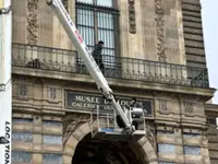 Louvre museum installs security bars on balcony used in October's heist