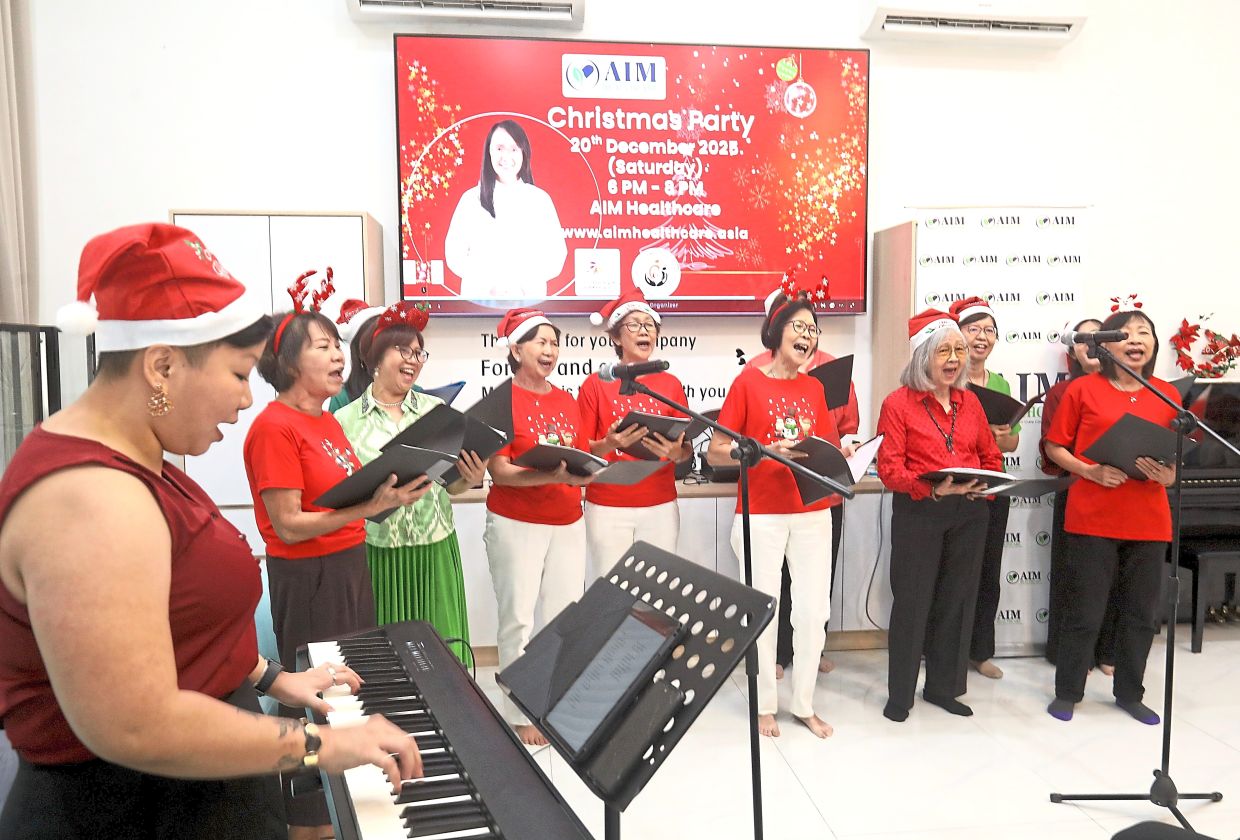 PAWE Subang Jaya members singing carols and bringing joy to the Christmas celebration at the AIM healthcare centre in USJ.
