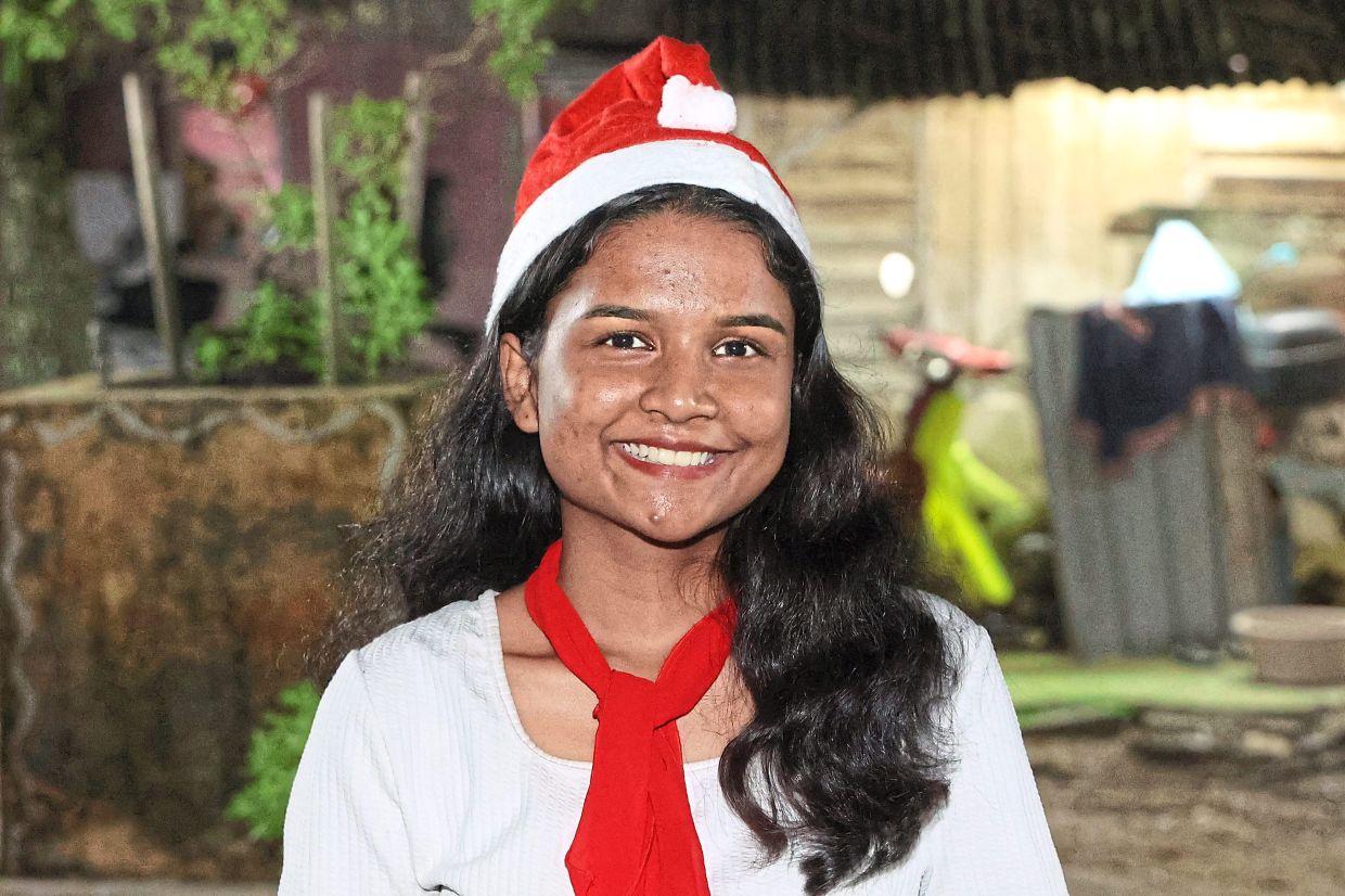 Caroller Hannah is happy to bring joy to those around her.