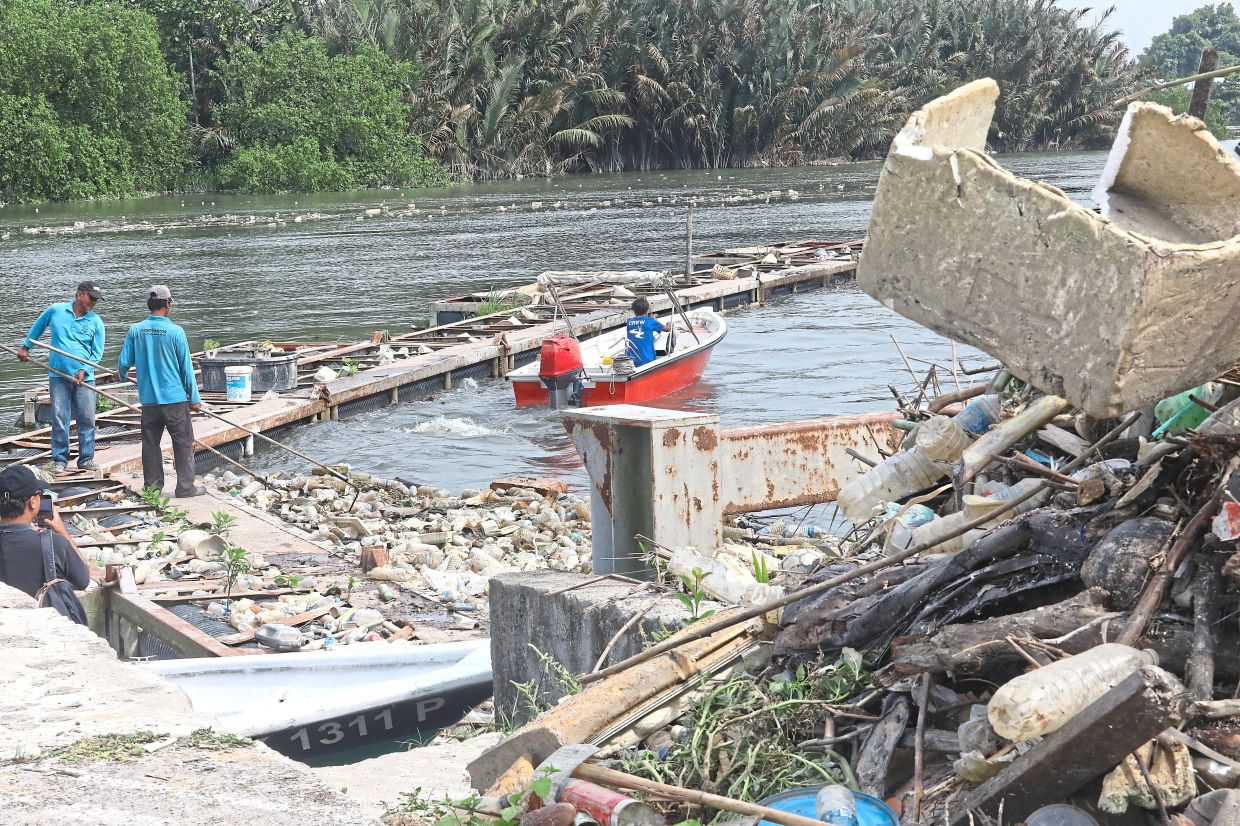 A plastic waste sorting facility was built along Sungai Klang to separate recyclables.