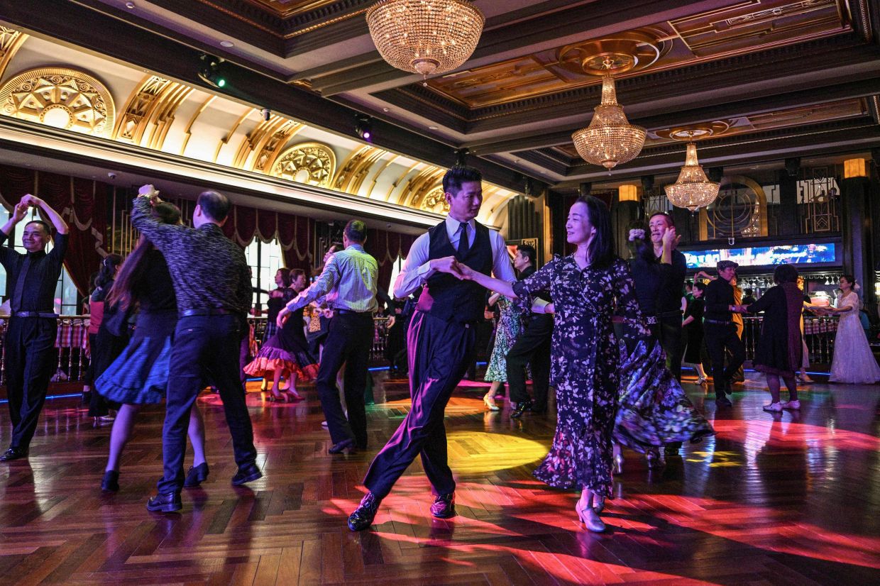 Couples dancing at the Paramount Ballroom in the Jing'An district of Shanghai. Photo: AFP 