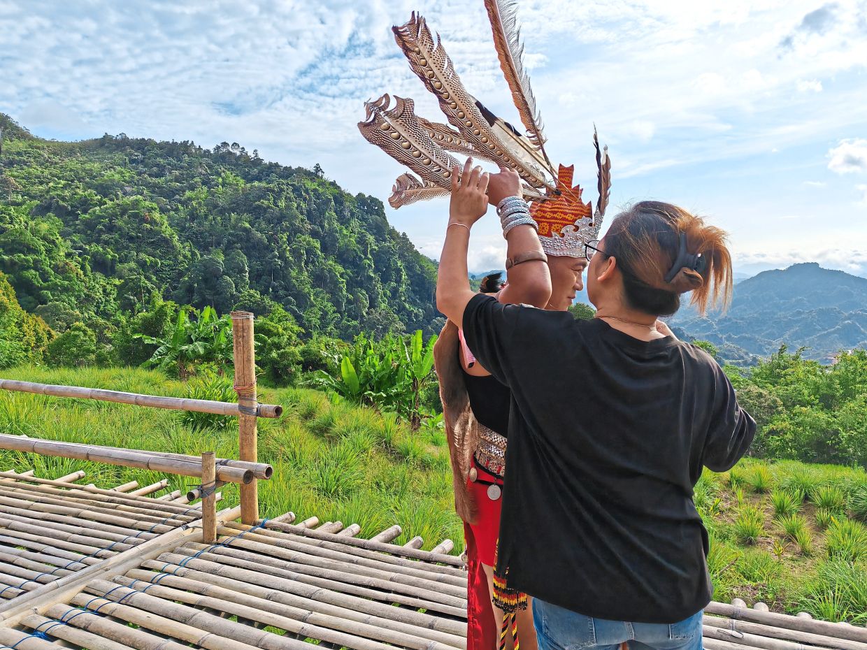 Getting ready to share. Visitors can join inthe land's ancestral traditions and indigenous wisdom through longhouse hospitality, crafts, music and dances.
