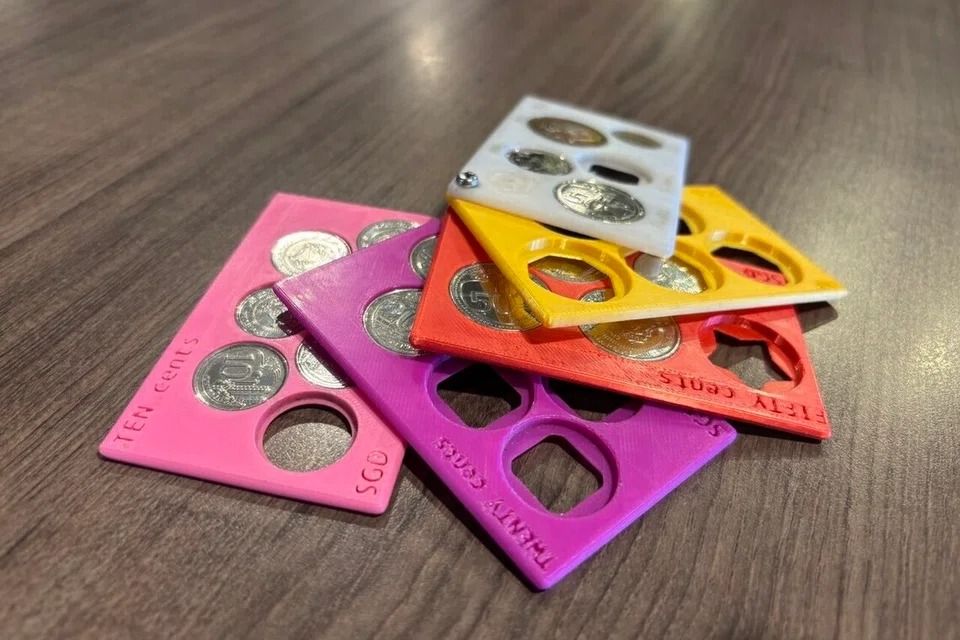 A coin holder designed to help users organise their coins by the value – 10 cents, 20 cents, 50 cents and $1. - ST