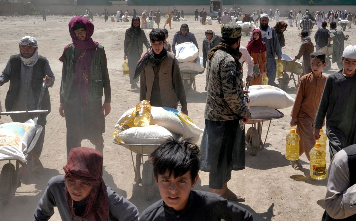 Millions of Afghans face hunger as aid cuts deepen a humanitarian crisis, says UN humanitarian chief
