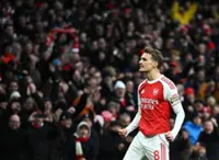 Soccer-Odegaard back on target as Arsenal reclaim top spot