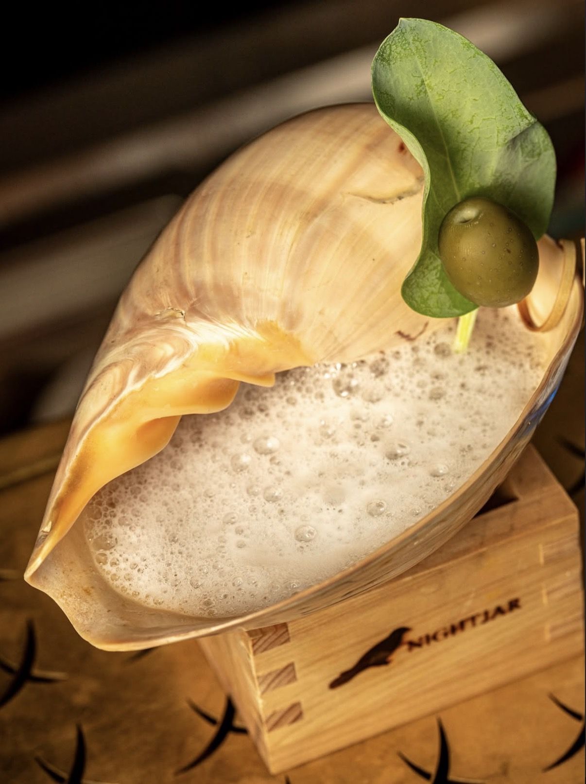 Nightjar's elaborately presented 'Beyond the Sea' cocktail is served in a giant shell.— Photo: Instagram/nightjar