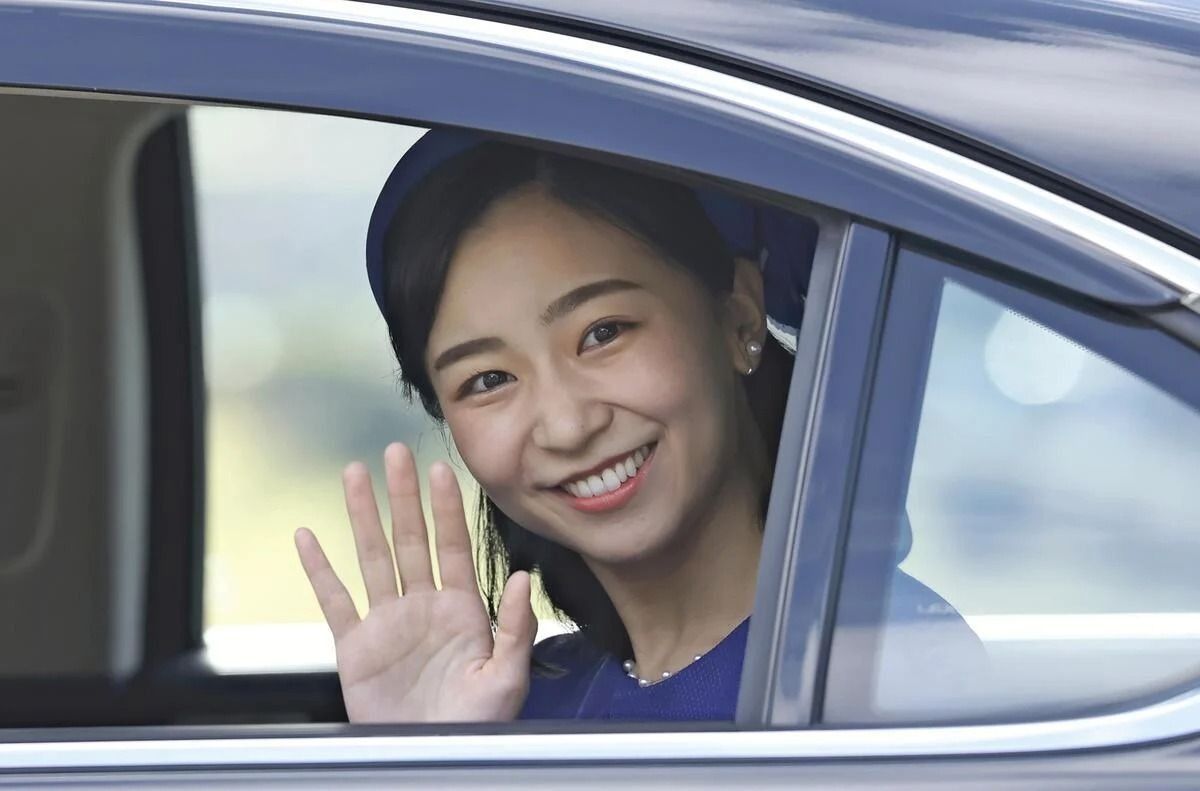 Japan’s Princess Kako, turning 31, waves to crowd gathered along road
