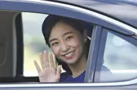 Japan’s Princess Kako, turning 31, waves to crowd gathered along road