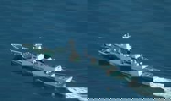 China blames military drills for reef damage around disputed shoal