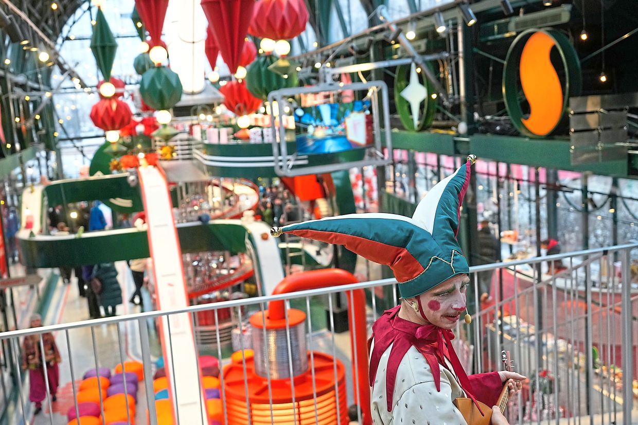 4. A dressed actor preparing for a performance at the Gift Factory Pavilion in Moscow, Russia. — AP