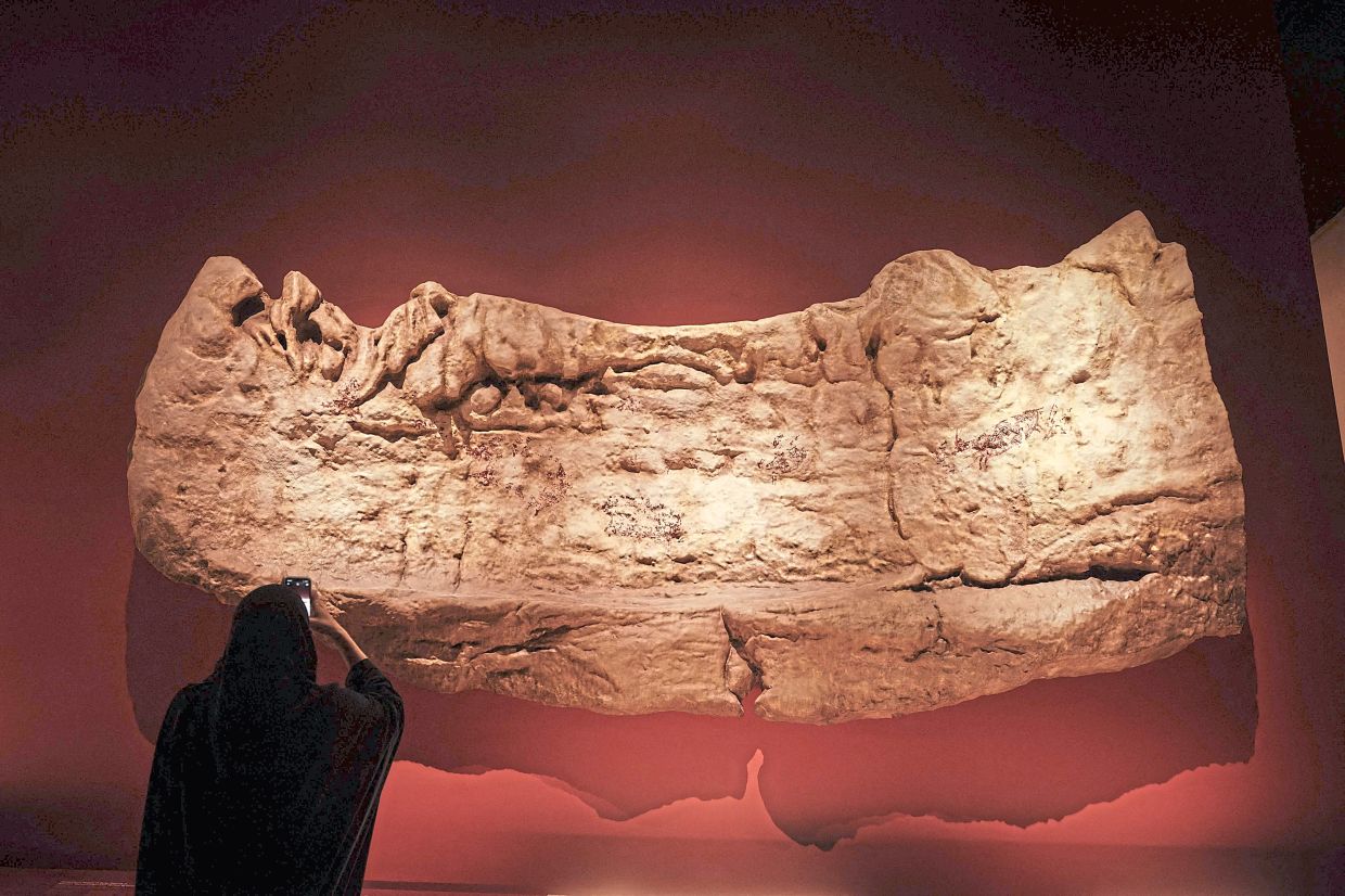 A 48,000-year-old South Sulawesi cave painting replica is now on display at the National Museum of Indonesia in Jakarta. Photo: AFP