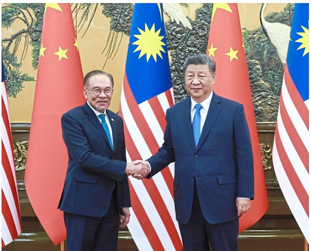 In September, Anwar (left) made his fourth visit to China since assuming office, working with President Xi Jinping to expand bilateral cooperation. 