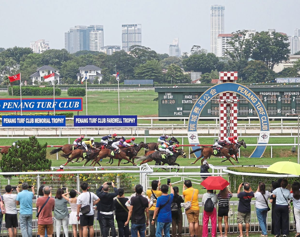Spectators watching the final races at the Penang Turf Club in Batu Gantong, which closed in May after 161 years.