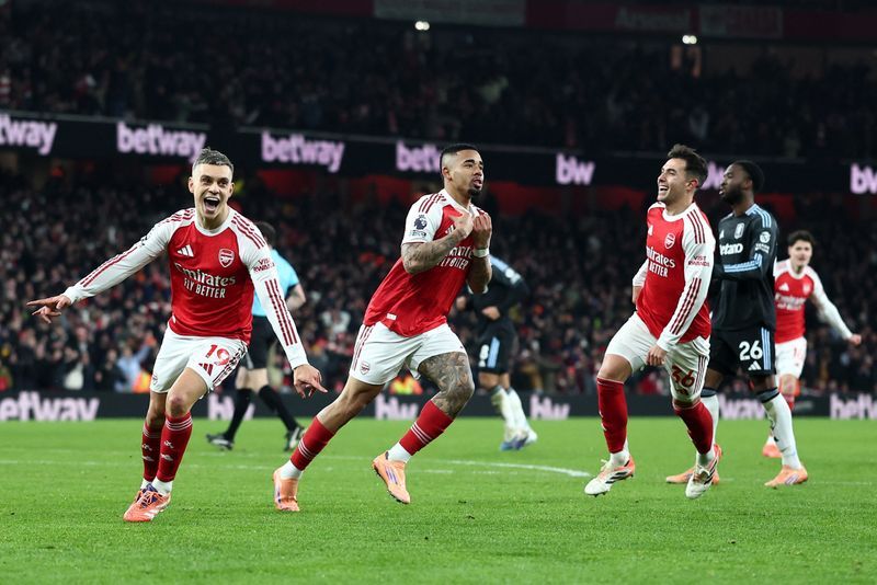 Soccer-Arsenal crush Villa to confirm title credentials