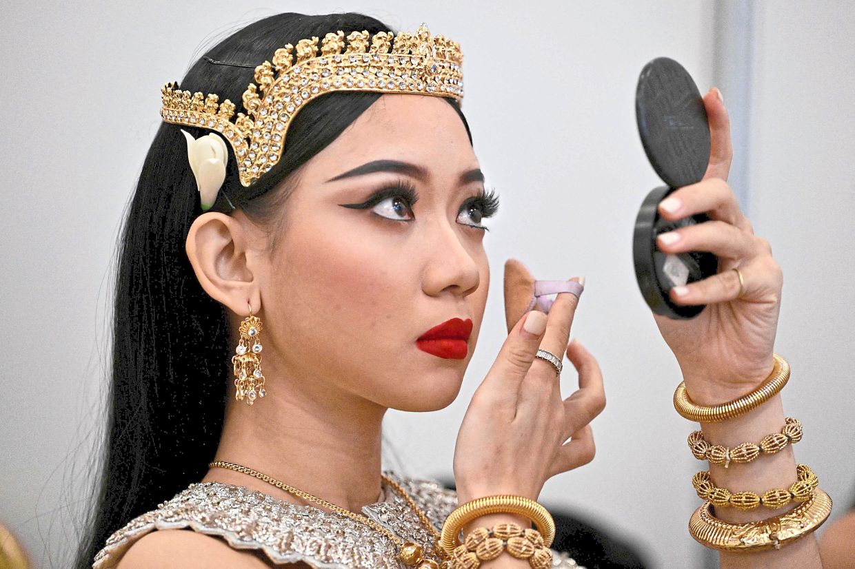 'This culture is really beautiful ... I want to be a traditional dancer and preserve it,' says student Tola Thina. Photo: AFP