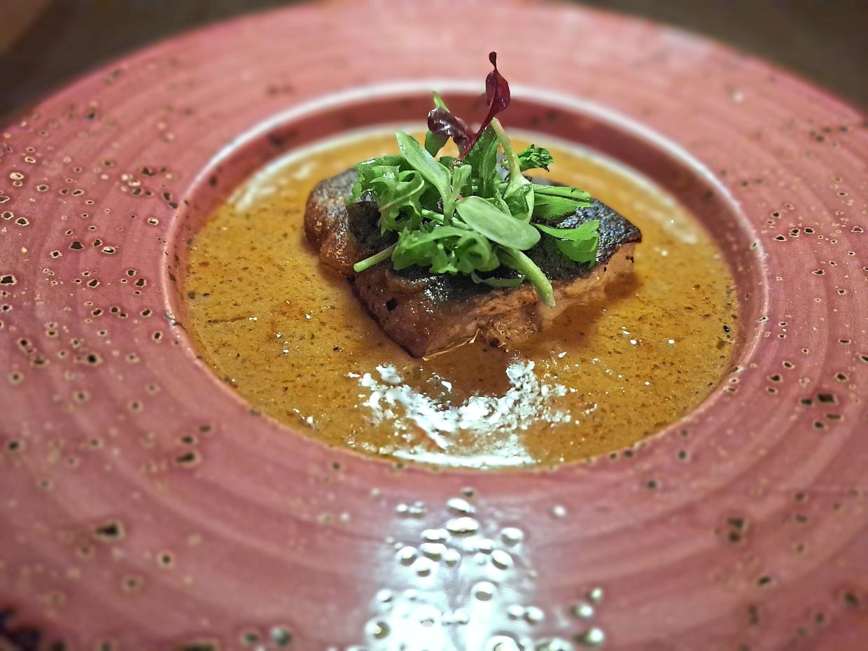 Shirayaki Sambal is basa belly, flame-roasted eggplant with ikan bakar sambal sauce and barley.