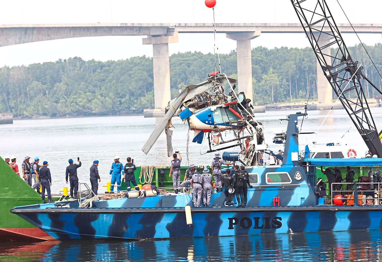 Wreckage of a police helicopter which was fished out from Sungai Pulai. — Filepic