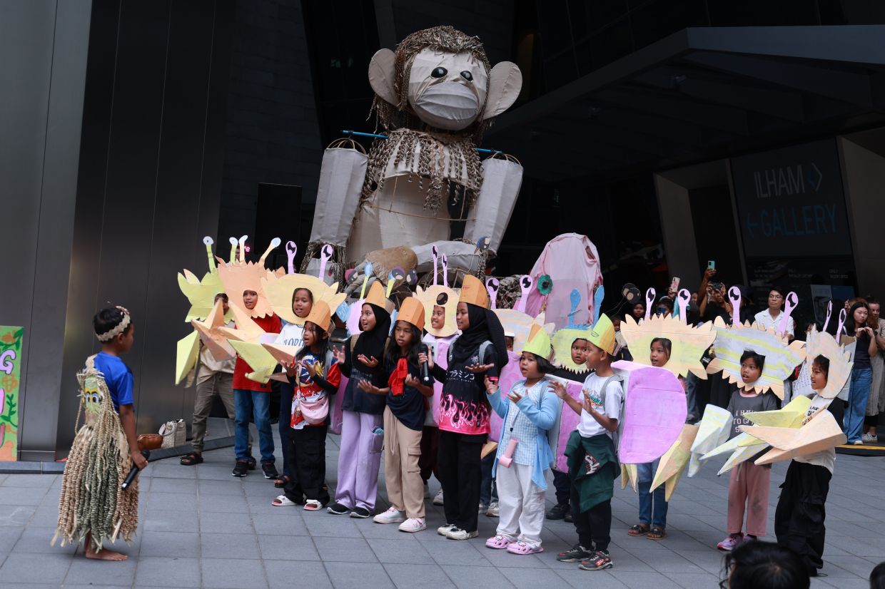 The Orang Asli children from Selangor earned a standing ovation for the Awas! Mawas! parade outside the Ilham building in KL on Aug 30, their humble puppets and recycled props proving that some stories resonate far beyond modest means. Photo: The Star/Kamarul Ariffin 