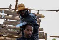 A Kenyan barber who wields a sharpened shovel thrives on Africa's social media craze