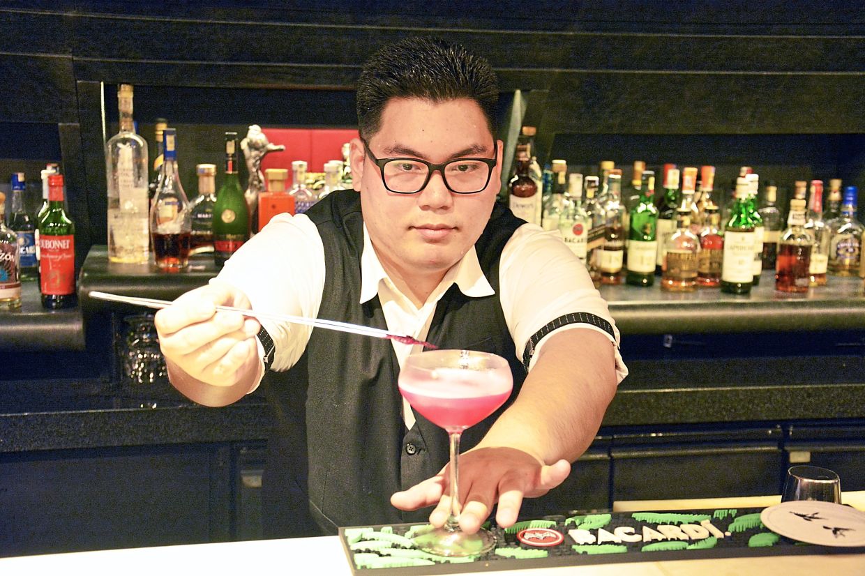 Ng adding final touches to the Bacchanal.