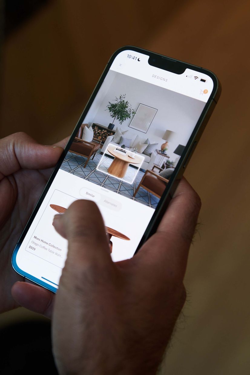 AI engineer Ankush Khandelwal demonstrates a mobile design tool with an AI conversation interface at the Havenly offices in Denver, Dec. 16, 2025. A growing number of home renovation and interior design platforms are rolling out A.I.-enabled imaging tools capable of redesigning rooms in an instant. — Theo Stroomer/The New York Times
