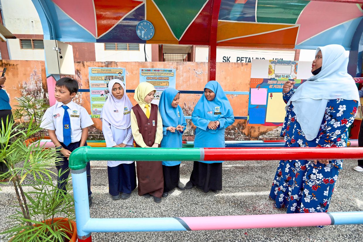 Schoolchildren at the child-friendly bus stop at SK Petaling Jaya.