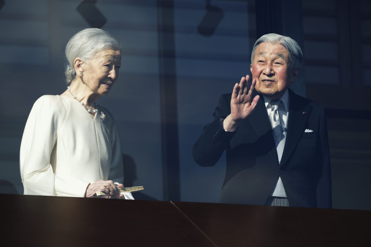 Japan's emperor and his family greet New Year well-wishers
