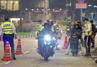 12,000 summonses, 20 held in traffic blitz