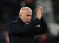 Soccer-Slot calls for 'magic' as Liverpool seek to bridge gap to title contenders